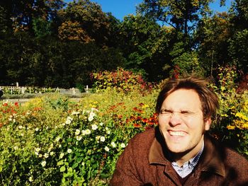 Full length of woman standing on tree trunk