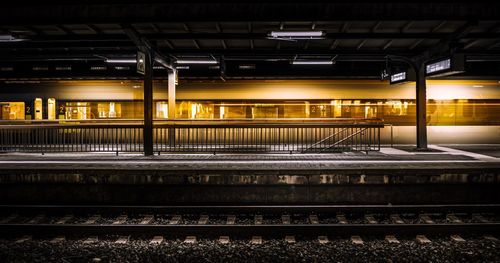 Illuminated railroad station at night