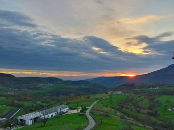 Scenic view of landscape against cloudy sky