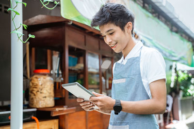 Young man using mobile phone