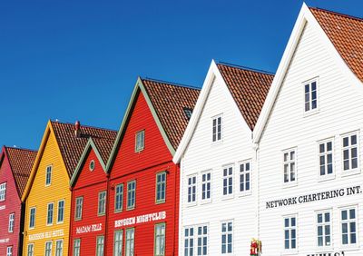 Low angle view of buildings against blue sky