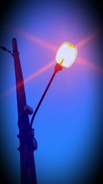 Low angle view of street light against sky