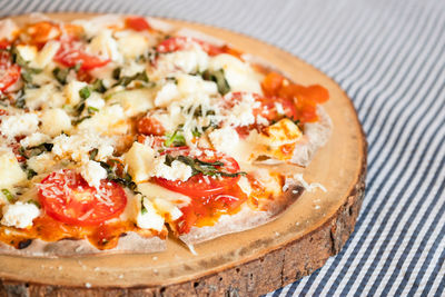 Close-up of pizza served on table