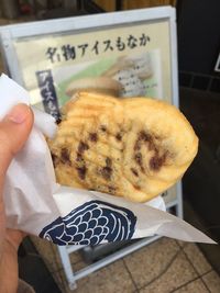 High angle view of person holding food