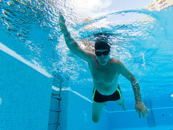 Man swimming in pool