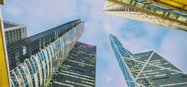 Low angle view of modern buildings against sky