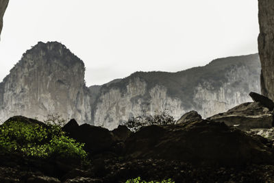 Low angle view of mountains against clear sky