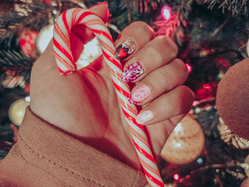 Close-up of woman holding christmas decorations