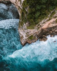 High angle view of rocks in sea