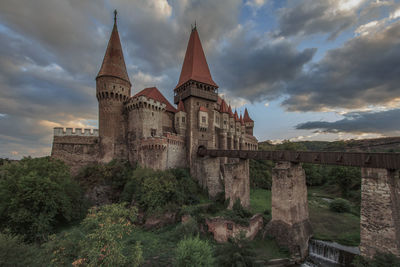 Historic building against cloudy sky