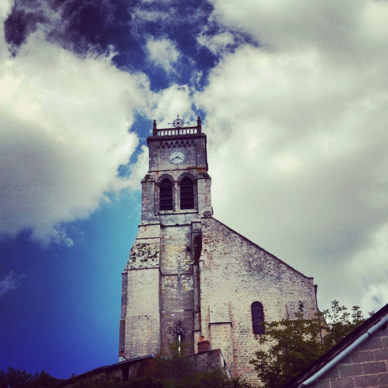 architecture, built structure, building exterior, low angle view, sky, religion, church, cloud - sky, place of worship, tower, history, spirituality, cloudy, cloud, clock tower, old, day, outdoors