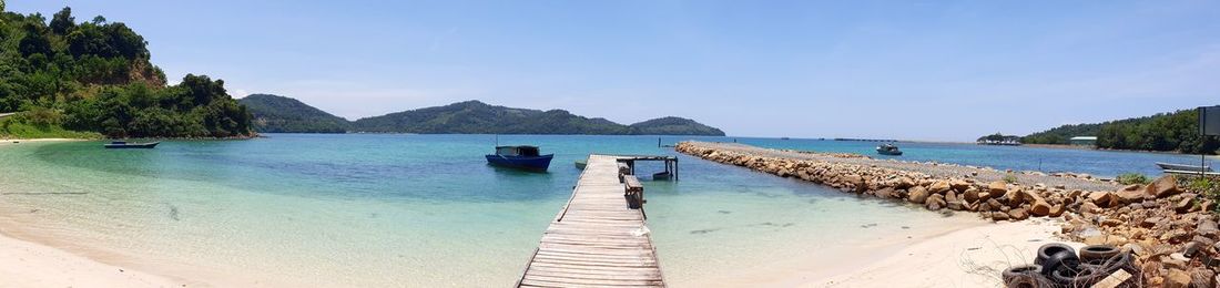 Scenic view of beach against clear sky