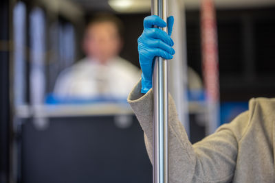 Close-up of man holding umbrella