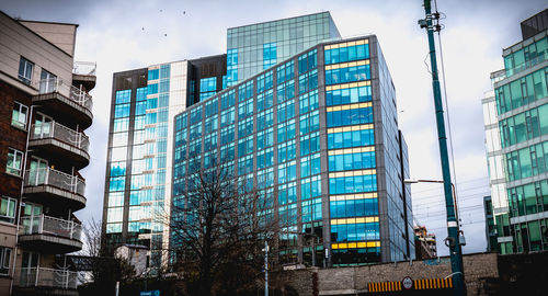 Low angle view of modern buildings against sky