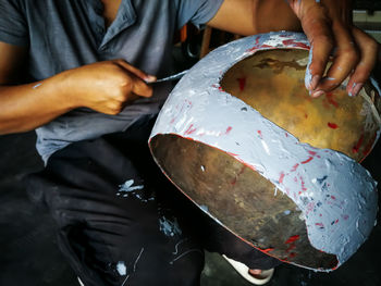 Midsection of man working