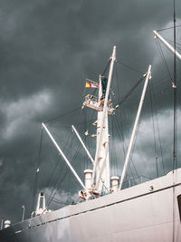 Low angle view of sailboat in sea against sky