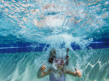 High angle view of man swimming in pool