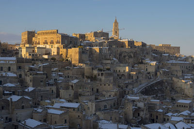 View of buildings in city against clear sky