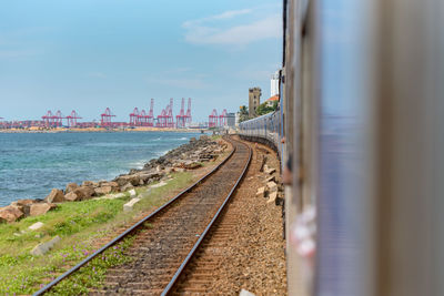 Panoramic view of railroad tracks against sky