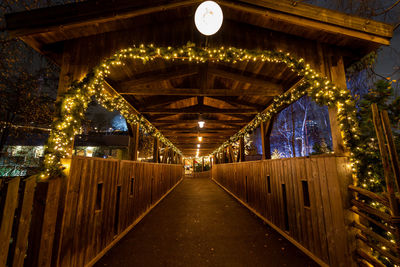 Wooden bridge decorated with led lights during christmas season