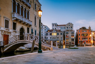 Buildings in city at night