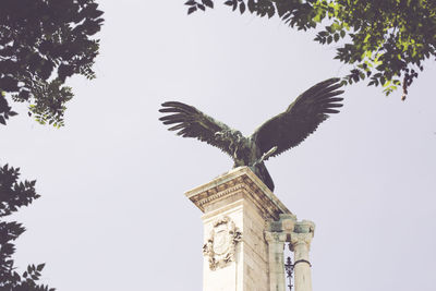 Low angle view of statue against clear sky