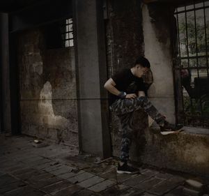 Full length of man standing in abandoned building