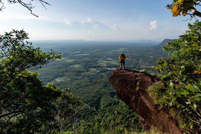 Scenic view of sea and mountains against sky