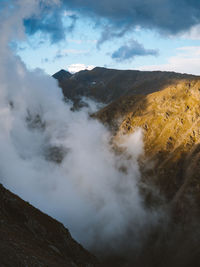 Scenic view of volcanic mountain against sky