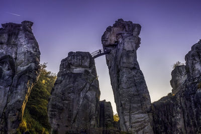 Low angle view of statue against sky at night