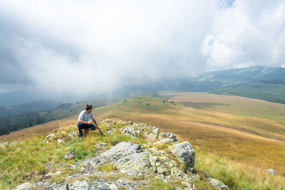 Full length of man on mountain against sky