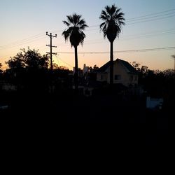 Buildings against sky at sunset