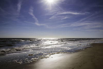 Scenic view of beach against sky during sunset