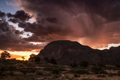 Scenic view of rock formation against sky during sunset