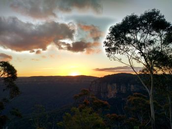 Scenic view of landscape against sky during sunset