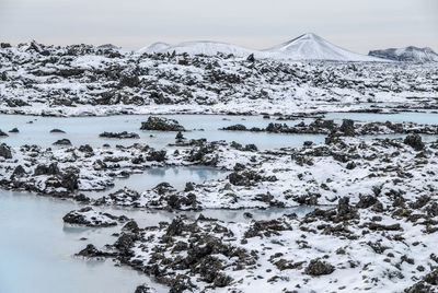 Scenic view of frozen lake against sky