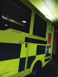 Close-up of yellow text on illuminated car