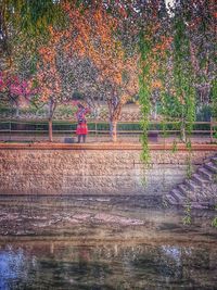 Woman walking in park during autumn