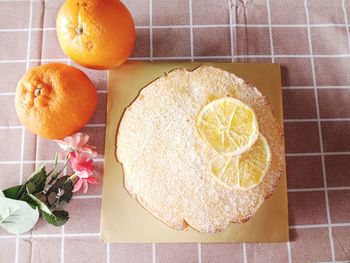 High angle view of orange fruits on tiled floor