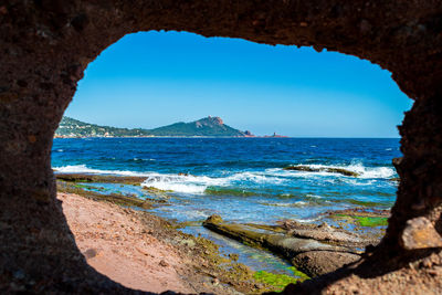 Scenic view of sea against clear blue sky