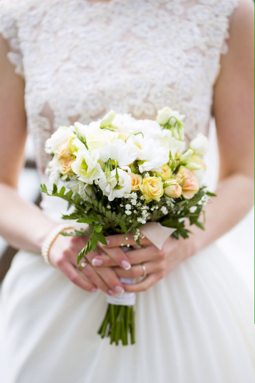 flower, person, freshness, holding, petal, lifestyles, fragility, part of, cropped, leisure activity, focus on foreground, close-up, flower head, indoors, white color, bouquet