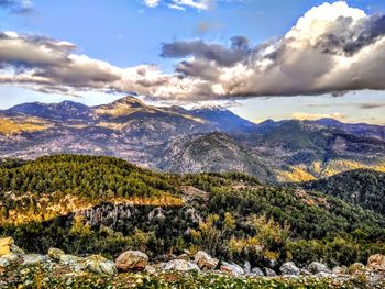 Scenic view of landscape and mountains against sky