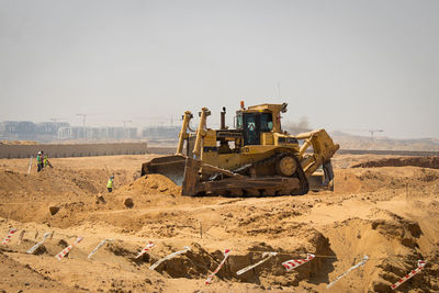 Construction site on field against clear sky