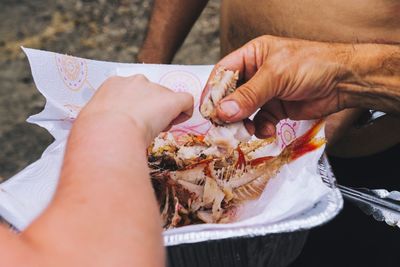 Close-up of people having fish