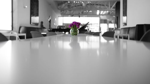 Close-up of flower vase on table at home