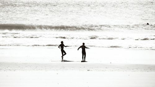 Full length of woman standing on beach