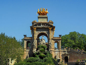 Low angle view of historical building against blue sky