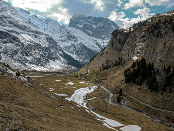 Scenic view of snowcapped mountains against sky