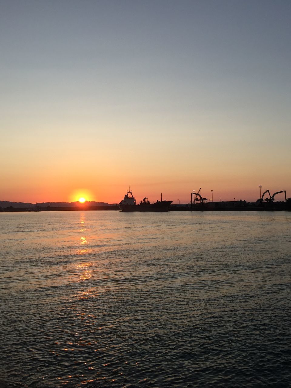 SCENIC VIEW OF SEA AGAINST ORANGE SKY DURING SUNSET