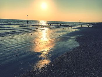 Scenic view of sea against sky at sunset